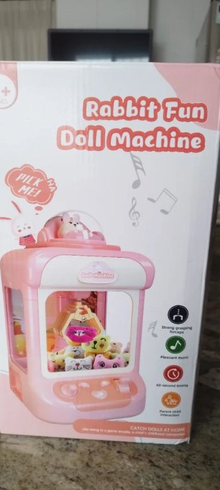 Máquina de gancho de juguete rosa