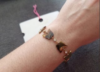 Pulsera mariposas y circonitas dorada en acero