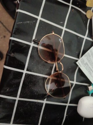 Gafas de sol Ray-Ban doradas y marrones