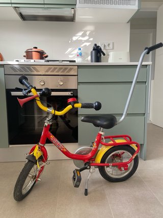 Bicicleta infantil Puky roja y amarilla
