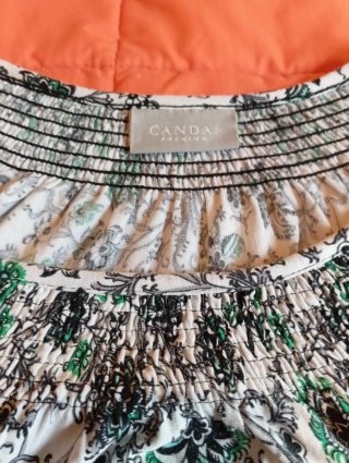 Blusa Candai estampada verde, blanca y negra.