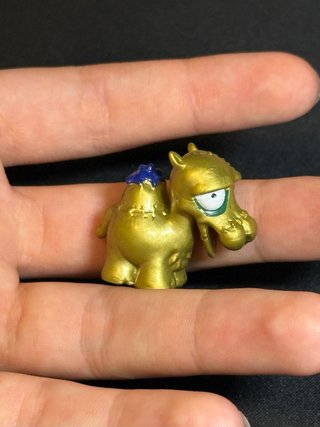 Zomlings Serie 2 Jamel Dorado Ultra Raro Oro #210