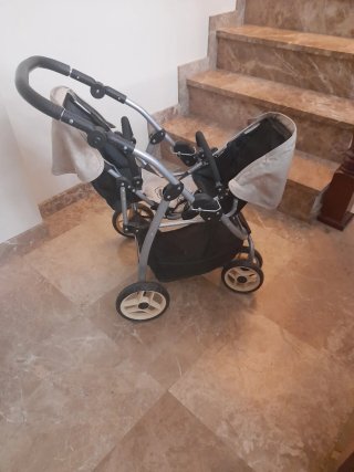 Carro gemelar de muñecas