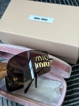 Gafas de sol Miu Miu sin montura doradas