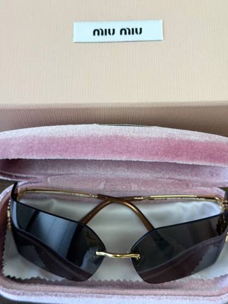 Gafas de sol Miu Miu sin montura doradas