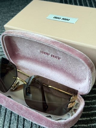 Gafas de sol Miu Miu sin montura doradas