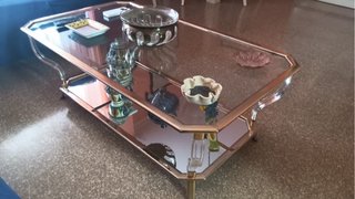 Mesa de centro cristal y metal dorado