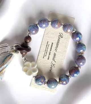 Pulsera bolas cerámica tonos galaxia con borla