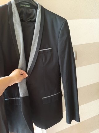 Traje chaqueta y pantalón negro