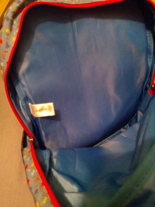 Mochila infantil dinosaurio surf