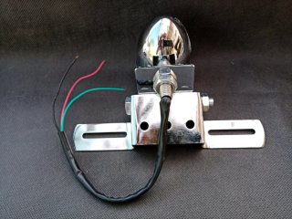 Porta matrícula con luz de freno cromado
