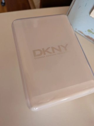 Pulsera DKNY con charms y reloj vintage