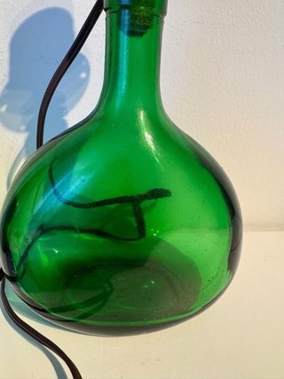 Vecchie lampade damigiana verde