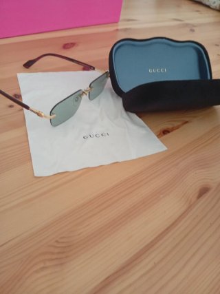 Occhiali da sole Gucci oro e verdi
