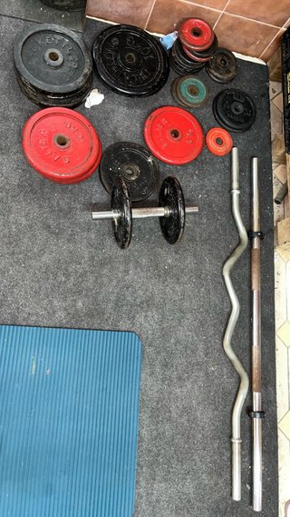 Multipower con discos, barras y pesos