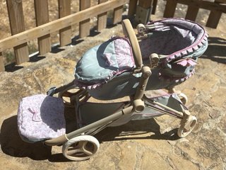 Cochecito de muñeca con bolso