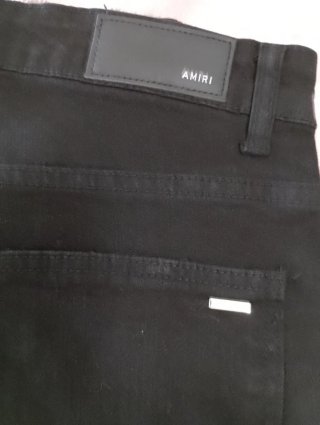 Pantalones Amiri negros con detalles morados