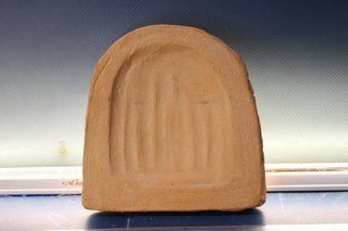 Reprodución de antefija del yacimiento del Convento de Mallén, época romana.