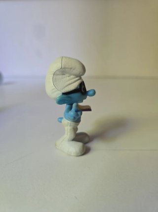 Statuetta Vintage Puffo Quattrocchi con Libro