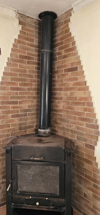 Chimenea de leña esquinera