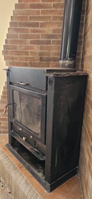Chimenea de leña esquinera