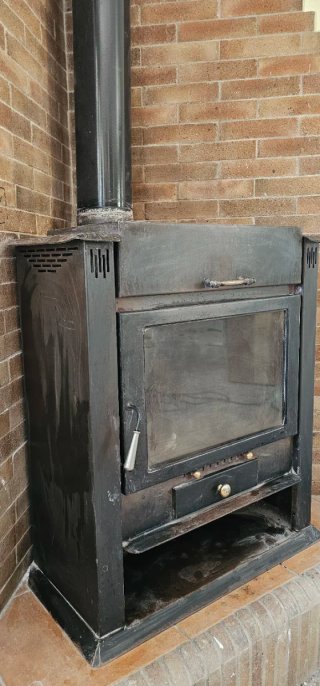 Chimenea de leña esquinera