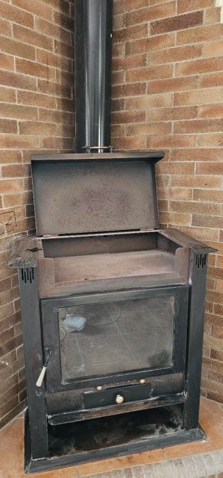 Chimenea de leña esquinera