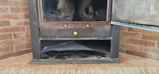 Chimenea de leña esquinera