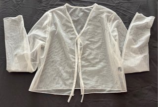 Blusa transparente blanca manga larga