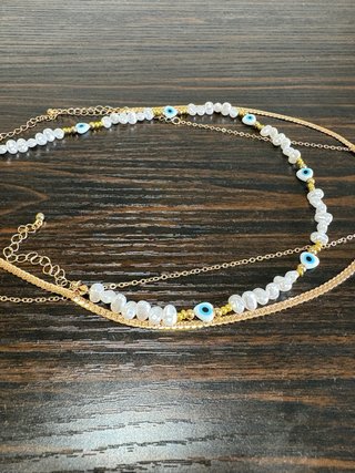 Collar y pulsera dorados con turquesa