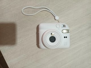 Fujifilm Instax Mini 12 + funda + álbum