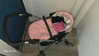 Carro de muñecas rosa