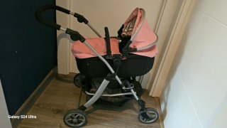 Carro de muñecas rosa