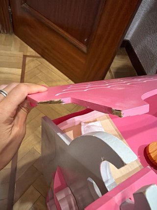 Casa de muñecas de madera rosa