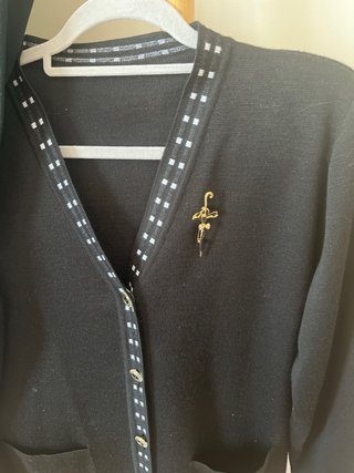 Conjunto 2 jerséis y broche
