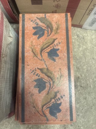 Azulejo decorativo floral naranja