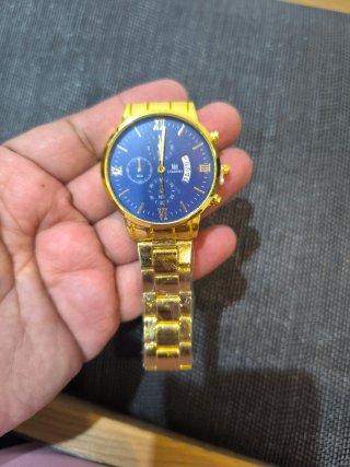 Reloj de hombre plateado y negro y dorado 3x1