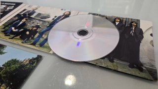 CDs Beatles Abbey Road y Let It Be (2009)