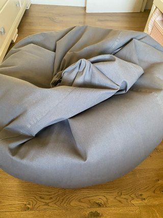 Puff sillón gris tela