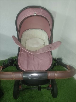 Carro de bebé rosa y negro