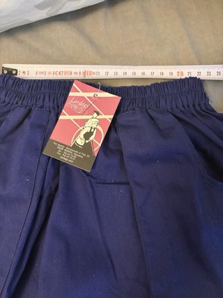 Falda azul arrantzal con bolsillos