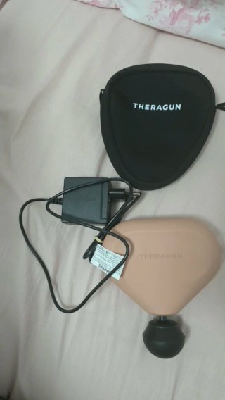 Theragun Masajeador y Cargador