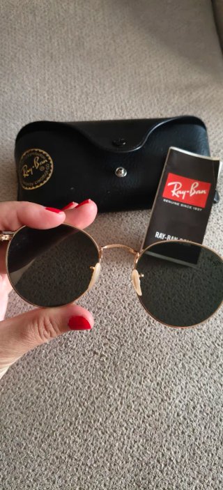 Gafas de sol Ray-Ban doradas y negras