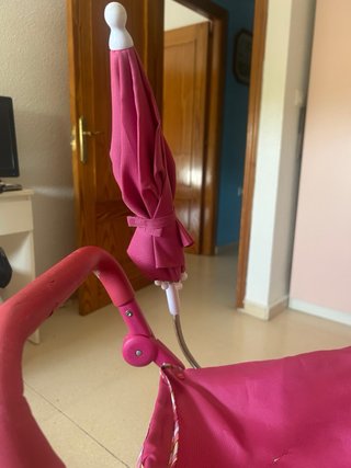 Cochecito de juguete rosa