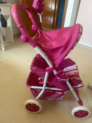 Cochecito de juguete rosa