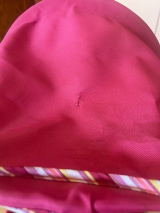 Cochecito de juguete rosa