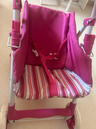 Cochecito de juguete rosa