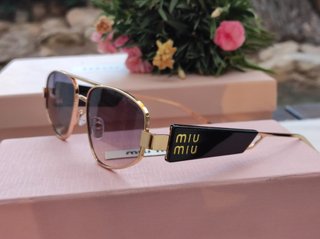 Gafas de sol Miu Miu doradas vintage