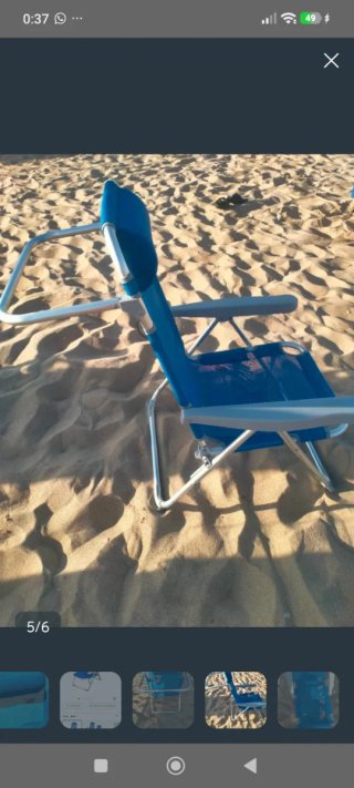 Silla reclinable azul y plateada