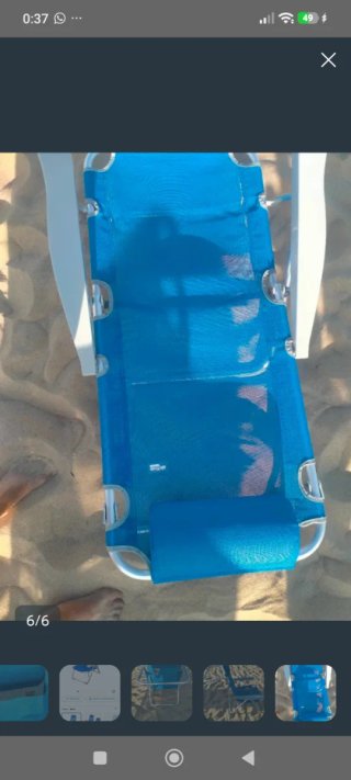 Silla reclinable azul y plateada